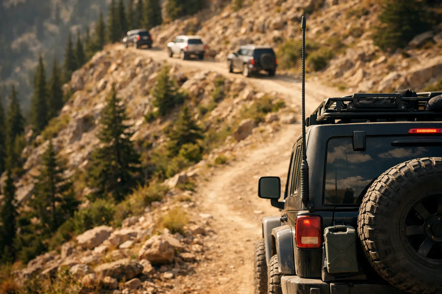 The last vehicle in a convoy on a switchback trail